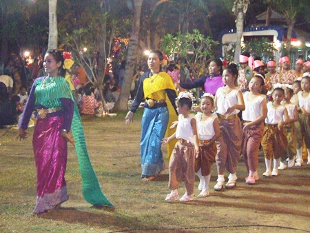 Beautiful goddesses saunter past the audience.