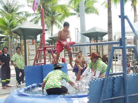 By knocking his opponent into the drink, the red corner wins!