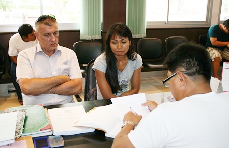 Frederic Granier and girlfriend Phanitch Chamkadklang report the crime to police. 