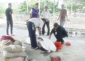 The dead mans body is removed from the scene