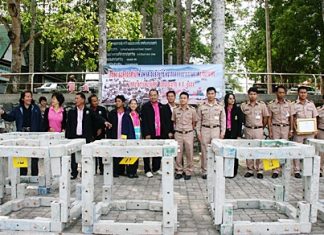 Local officials gather around the soon to be installed artificial reefs in Bang Saray.
