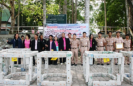Local officials gather around the soon to be installed artificial reefs in Bang Saray. 