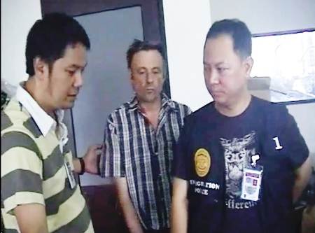 The owner of Sexy Boutique is led away by police