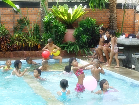 The children have fun playing in the pool.
