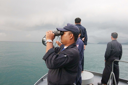 A Navy search and rescue team scours the horizon for signs of the missing Russian tourist. 