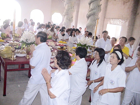 Public officials and community leaders from around Sriracha perform the Wien Thien during the foundation stone ceremony. 