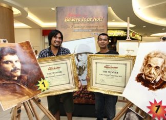 Jintanakarn Maneerat (left) won top prize for his painting of Freddie Mercury, whilst Ruangyot Kungsasri (right) won the student category for his drawing of Albert Einstein.