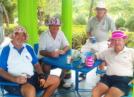 From the left: John, Jack, Chad & Geoff sporting their hats, knitted by the caddies, at Pattaya Country Club, Tuesday, May 17. 