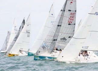The fleet races downwind in the mid-May club series off Jomtien beach.
