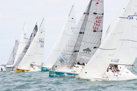 The fleet races downwind in the mid-May club series off Jomtien beach.