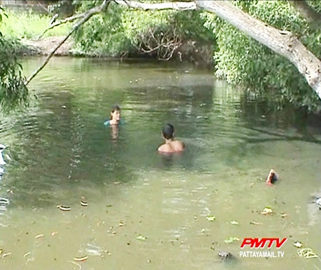 Police search the pond for remains of stolen motorbikes.