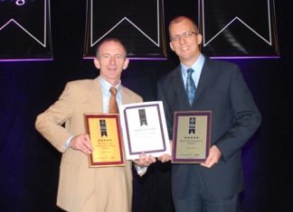 Stuart Shield, left, Chairman of the International Hotel Awards and Harald Feurstein, right, General Manager of Hilton Pattaya, hold up the awards presented to the hotel at the Asia Pacific Hotel Awards 2011 ceremony at the Longemont Hotel, Shanghai, May 31.