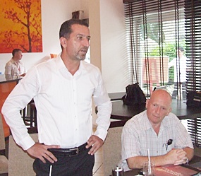 Miki Haim, Managing Director of Matrix, left, addresses the members of REBA during their monthly meeting.