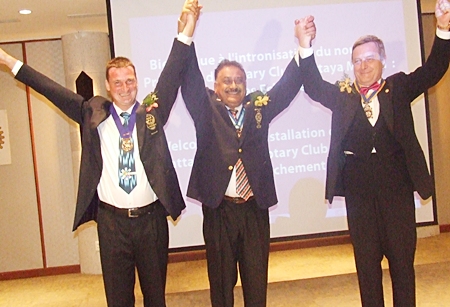 PDG Peter hails outgoing President Eric Larbouillat (left) and incoming President Yves Echement, Rotary Club Pattaya Marina.