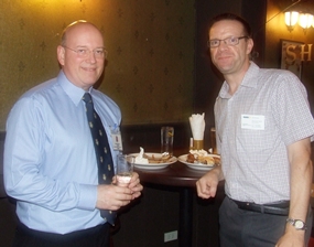 Graham Macdonald (chairman of the BCCT) and Roger Wilson (GKN Driveline) find a quiet corner to nibble on the delicious ribs.