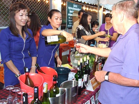 Guests milled about tasting fine foods and wines imported from all corners of the world