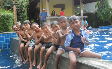 Mercy Center boys “line up” in the Palms Resort swimming pool.