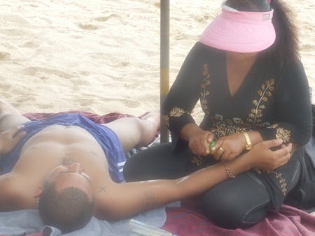 Pramote Sapsang, director of the city’s Natural Resources Department, says that beach masseuses are unregulated and none have licenses. 