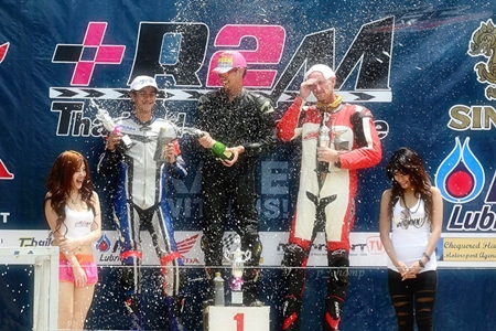 Ben Fortt, 2nd left, celebrates on the podium following his second place finish at Nakhon Chaise, Sunday, June 19.