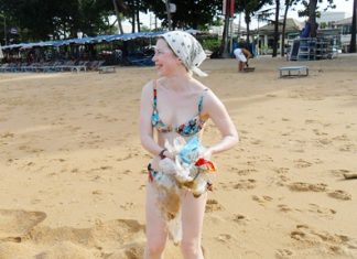 Virginia from Moscow helps keep the beach clean on her holiday here.