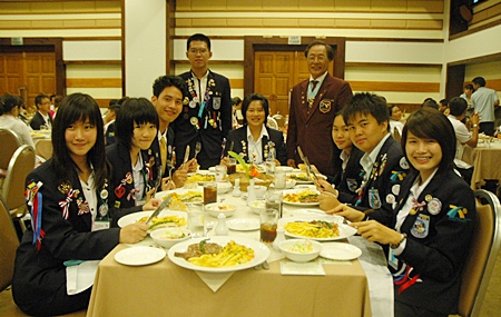 DG Thongchai (standing right) oversees the children during the ‘dining etiquette’ training session.