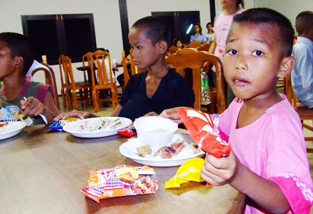 The children very much enjoy their delicious supper.