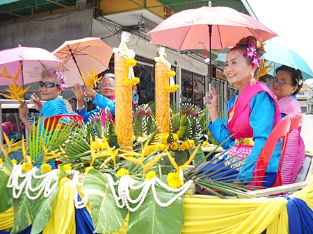 These four women, whose combined ages total more than 300 years, mark the start of Buddhist Lent with a traditional dance and parade in Sattahip. 