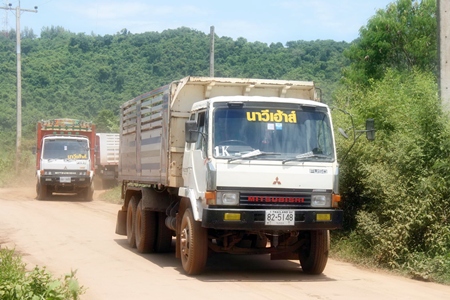 Residents say 10-wheeled trucks carrying soil are throwing dirt and dust into the air, causing respiratory problems in neighborhood children. 