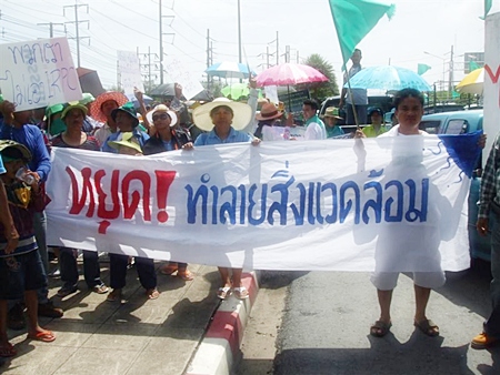 Rayong residents protest outside Integrated Refinery & Petrochemical Complex Co.’s Maptaput facility. 