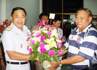 Navy rugby players congratulate former instructor, new MP Surapol Adm. Supakorn Buranadilok (left) congratulates his friend, former admiral and new MP Surapol Chandang (right).