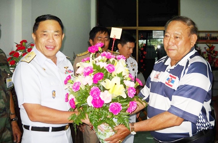 Adm. Supakorn Buranadilok (left) congratulates his friend, former admiral and new MP Surapol Chandang (right). 