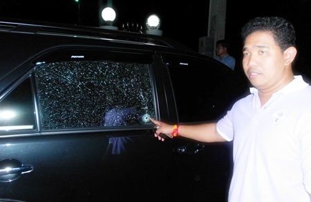 One of the victims points to the damage to his SUV. 