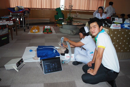 Experienced staff demonstrate new technology used in administering CPR.