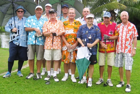 The garishly attired golfers assemble for a group photo at Emerald. 