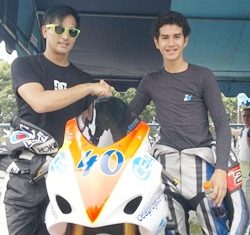 Ben Fortt (right) is congratulated by Thai movie star Pete Thongjure at the Bira race circuit in Pattaya, Sunday, July 17.