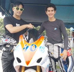 Ben Fortt (right) is congratulated by Thai movie star Pete Thongjure at the Bira race circuit in Pattaya, Sunday, July 17.
