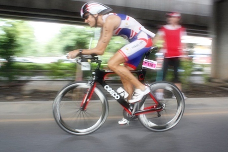 Woodlands Hotel & Resort’s General Manager Stephane Bringer cycles during the Bangkok Triathlon, Sunday, July 10, 2011. 