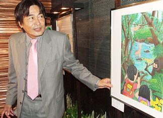 Deputy Mayor Ronakit Ekasingh examines one of the artworks on display.