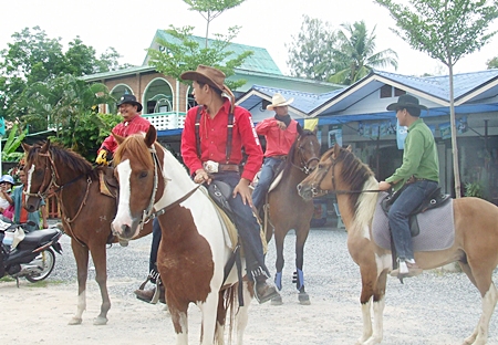 Men on horseback prepare to join the fun.