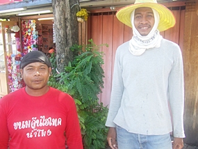 Charun Sunrang (left) and friend Supoj Praisang (right) are proud to be helping build the kingdom’s infrastructure. 
