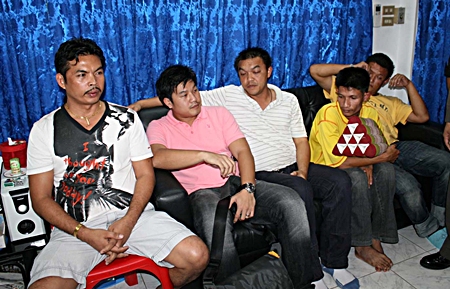 Sampan Kammanee (left) and his crew were arrested for allegedly running an illegal lottery.