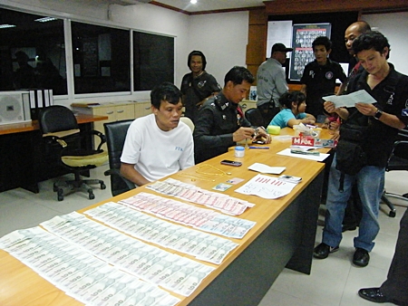 Somphan Kumphanyaem (seated, left) will be going through the court process one more time after being caught, again, selling illicit drugs. 