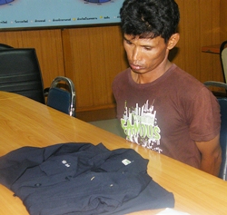 Charan stares forlornly at his Office of Narcotics Control Board uniform during his arrest for dealing drugs. 