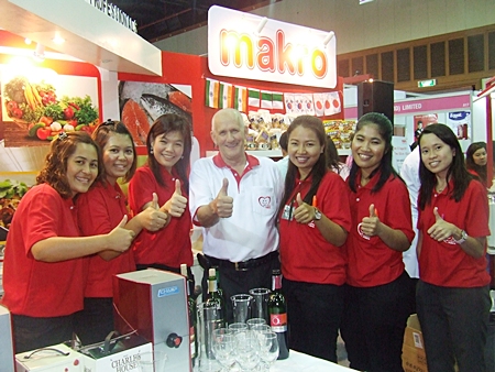 John Pothecary (center) and his lovely and attentive team at the Pattaya Food & Hoteliers Expo 2011. 