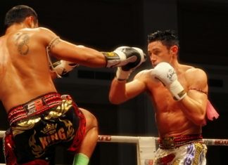 Saiyok Pumpanmuang from Thailand (left) takes on Australia’s Bruce Macfie during the Grand Opening of the second Thailand vs Challenger (2011) Series held at River City Hall, Bangkok on Saturday, July 23.