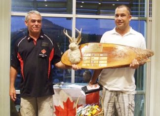 2011 Canadian Jackalope Champion Paul Daud (right) is handed the perpetual trophy by Dale Drader.