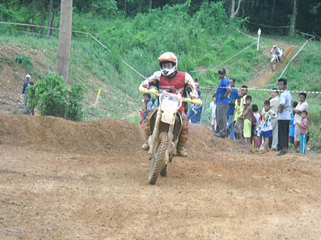 Riders emerge from the jungle.