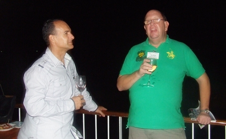 Les Nyerges (Capital TV) and Paul Whyte shoot the breeze on the terrace overlooking the beach.