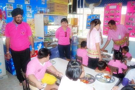 Rotarians provide lunch for the mentally challenged children. 