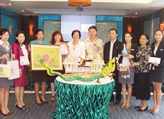 Siam Bayview’s technical department won first prize with their Traditional Thai house (center). Housekeeping took second place with a framed artwork of a bed of flowers (left), and the Accounting Department’s figure of a mythical phoenix (right) won third place.